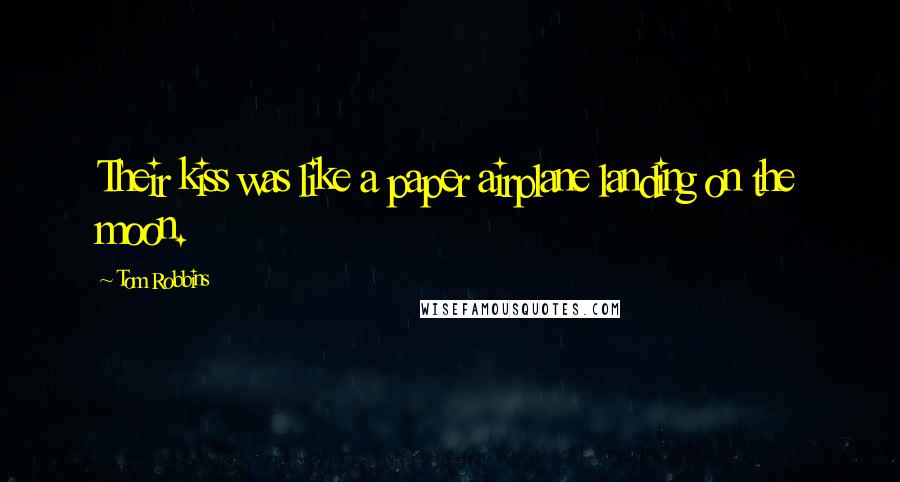 Tom Robbins Quotes: Their kiss was like a paper airplane landing on the moon.