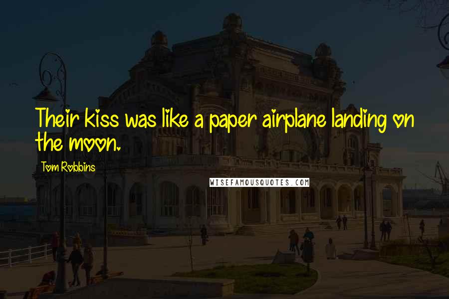 Tom Robbins Quotes: Their kiss was like a paper airplane landing on the moon.