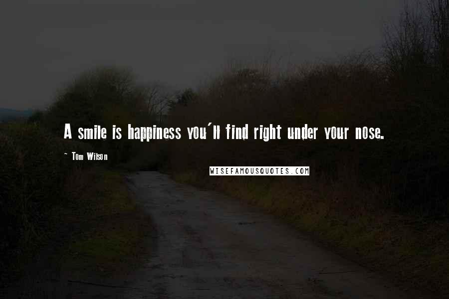 Tom Wilson Quotes: A smile is happiness you'll find right under your nose.