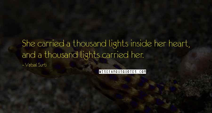 Vatsal Surti Quotes: She carried a thousand lights inside her heart, and a thousand lights carried her.