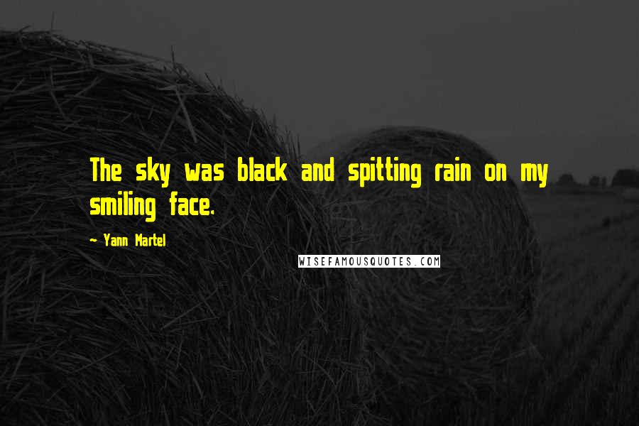 Yann Martel Quotes: The sky was black and spitting rain on my smiling face.