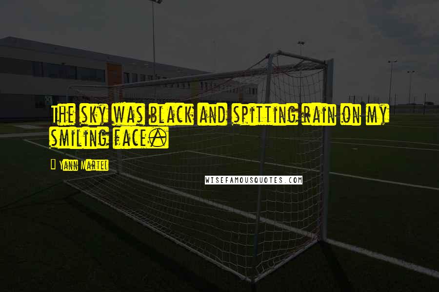 Yann Martel Quotes: The sky was black and spitting rain on my smiling face.