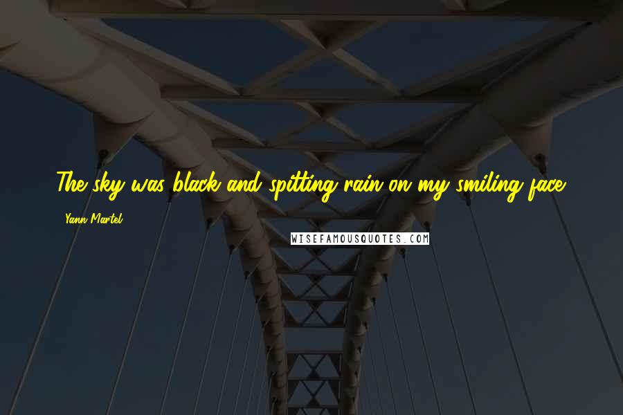 Yann Martel Quotes: The sky was black and spitting rain on my smiling face.